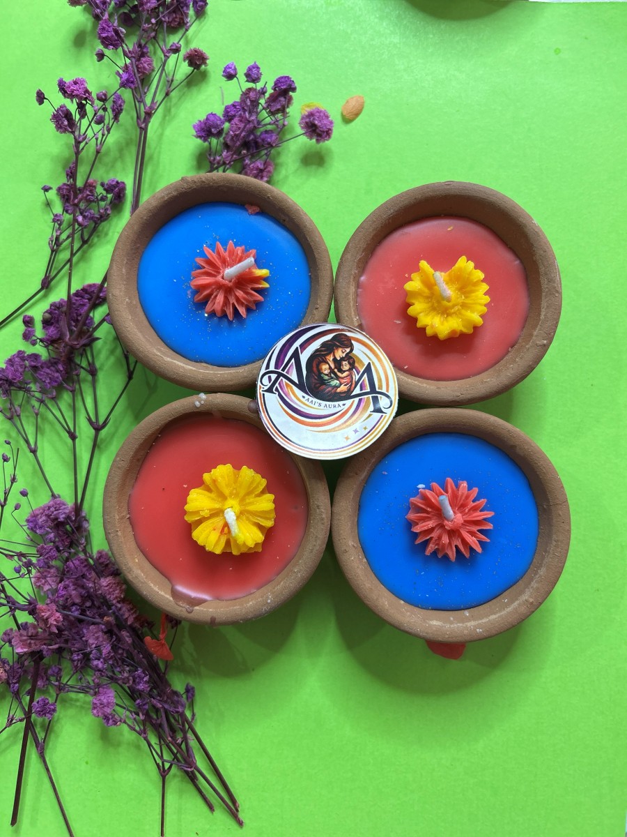 Pack of four clay diyas, two blue and two red