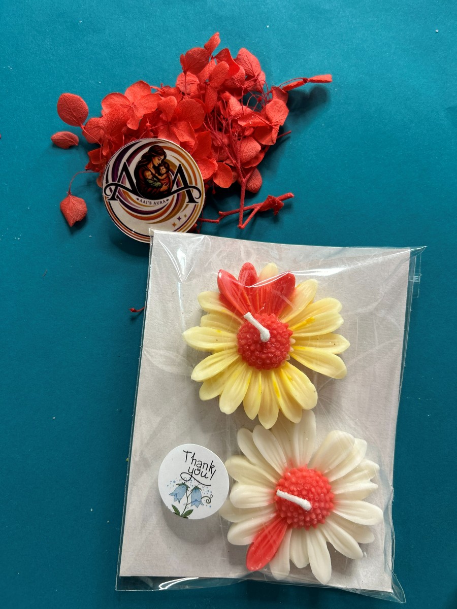 Two daisy candles photographed together. Sold individually.