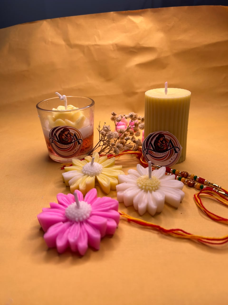 The ribbed pillar beside a glass candle and daisy candles. The pillar is sold on its own.