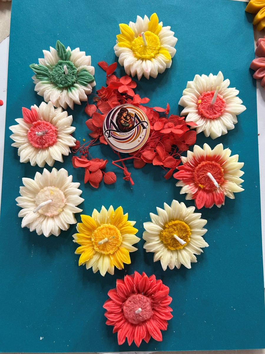 Sunflower candles in red, yellow, white, and green-tipped finishes
