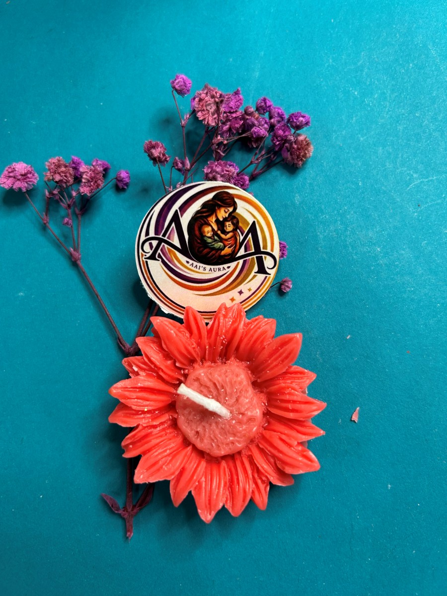 A single red sunflower candle