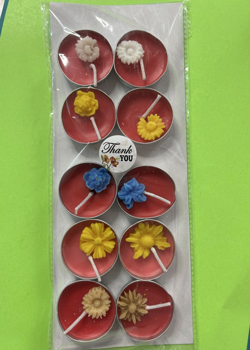 Pack of ten red decorative tea lights with wax flowers